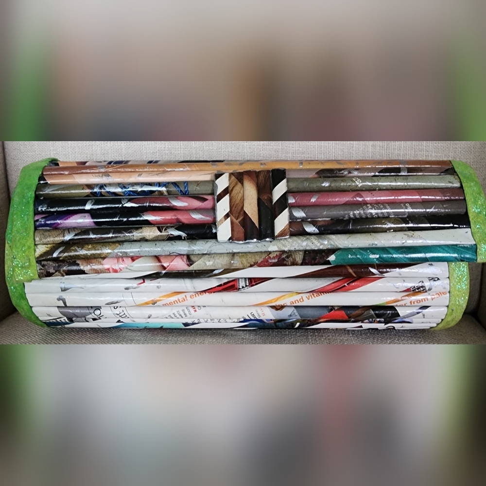 Recycled magazine pages clutch.